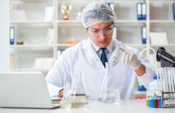 Young researcher scientist doing a water test contamination experiment in the laboratory